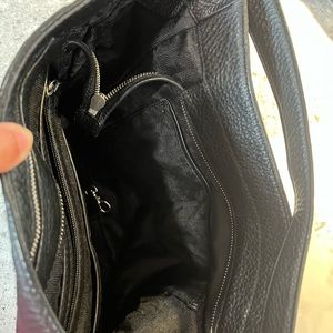 MK Authentic purse. Black leather with lots of storage.